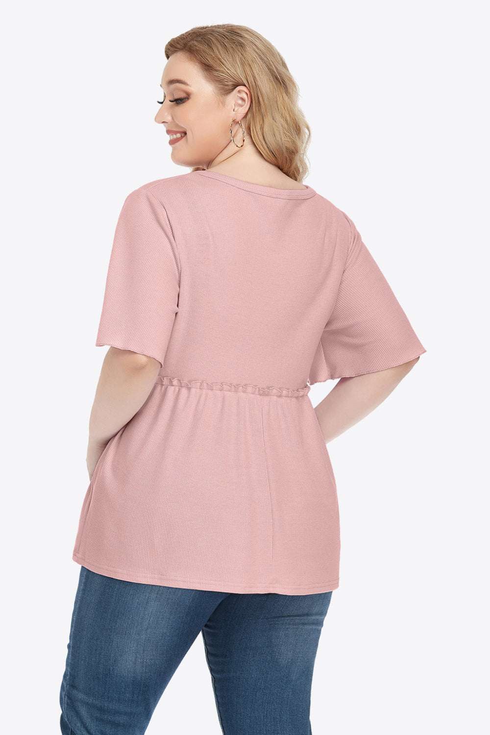 Plus size babydoll blouse with buttoned V-neck, frill trim, and flutter half sleeves.