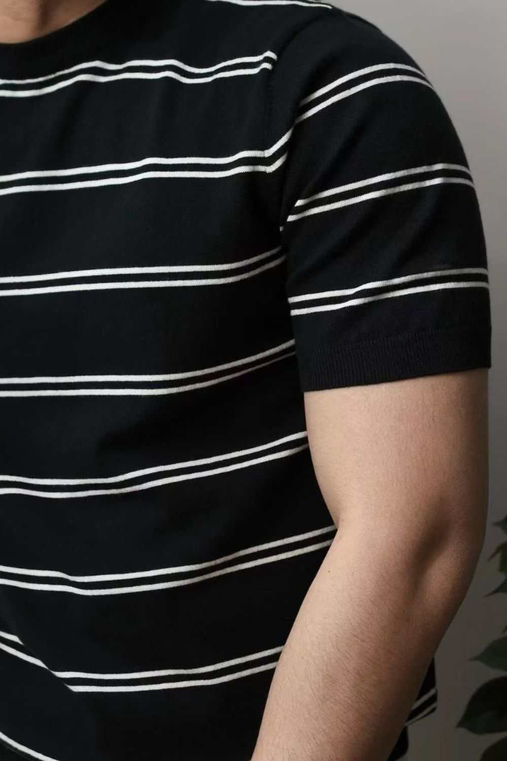 Men's plus size black round neck striped t-shirt with moderate stretch.