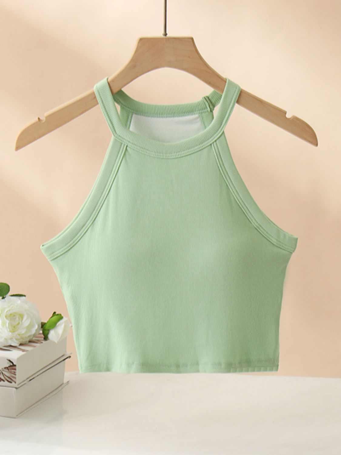 Ribbed Grecian neck cropped tank with chest pads in green, highly stretchy and opaque.