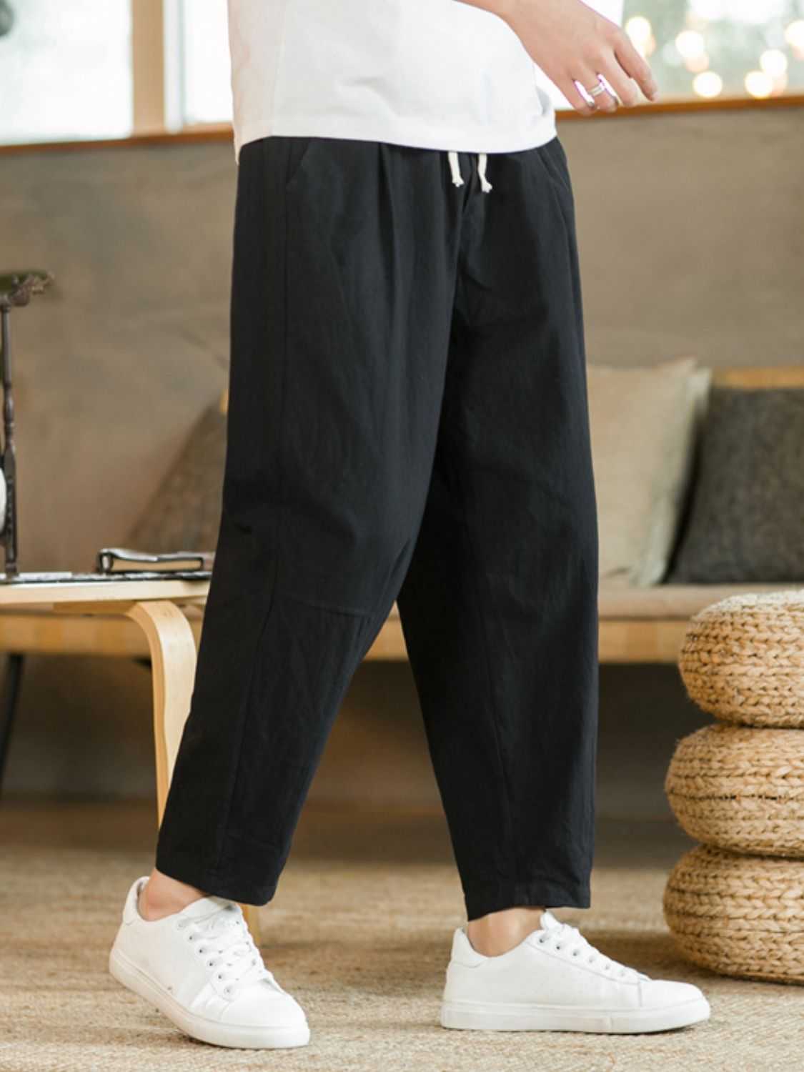Plus size black drawstring pants with pockets, made of cotton and flax.