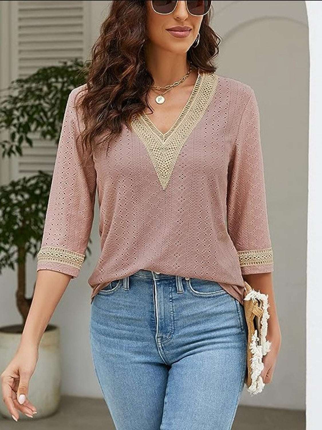 V-Neck Eyelet Blouse in pink, featuring long sleeves and a casual style.