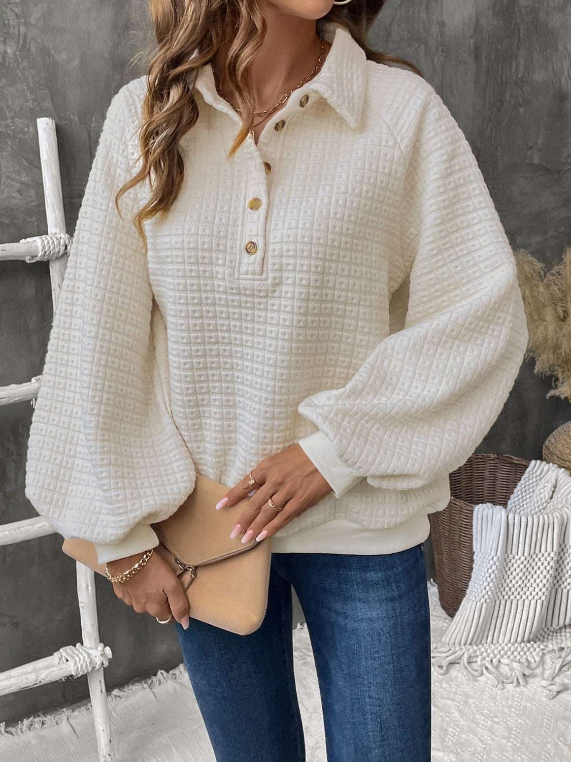 Perfee Half Button Long Sleeve Sweatshirt in ivory with buttoned front design and slightly stretchy material.
