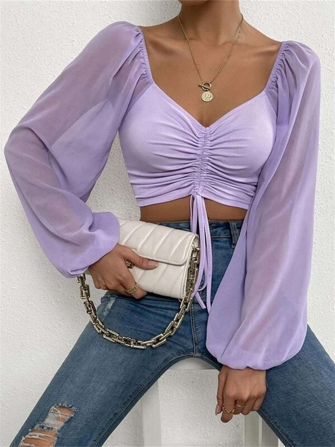 Drawstring sweetheart neck cropped top in lavender with semi-sheer sleeves.