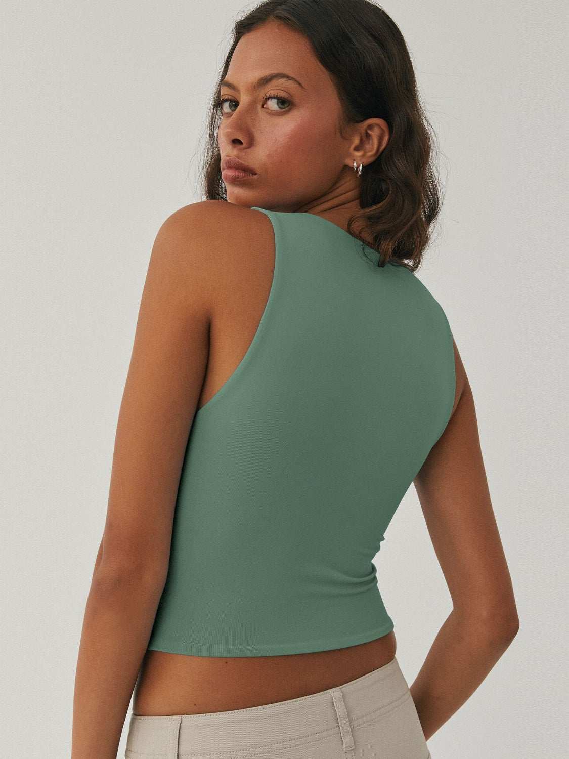 Women's green round neck cropped tank, basic style, slightly stretchy, polyester-elastane blend.