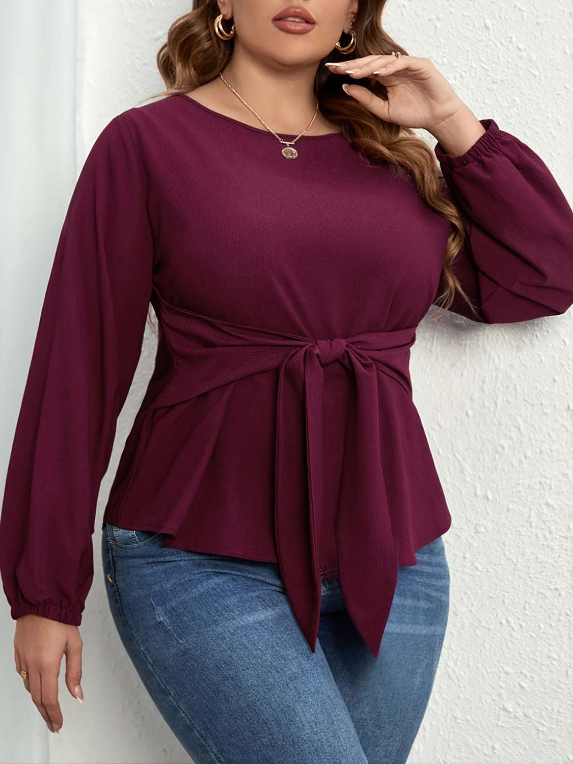 Plus size tie front long sleeve blouse in burgundy with a round neck and cinched waist detail