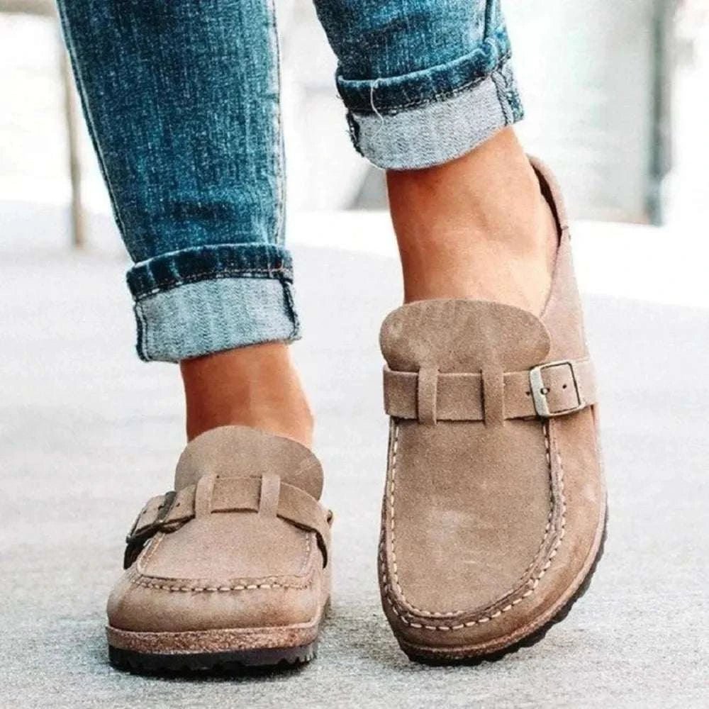 Round toe low heel buckle loafers in brown.