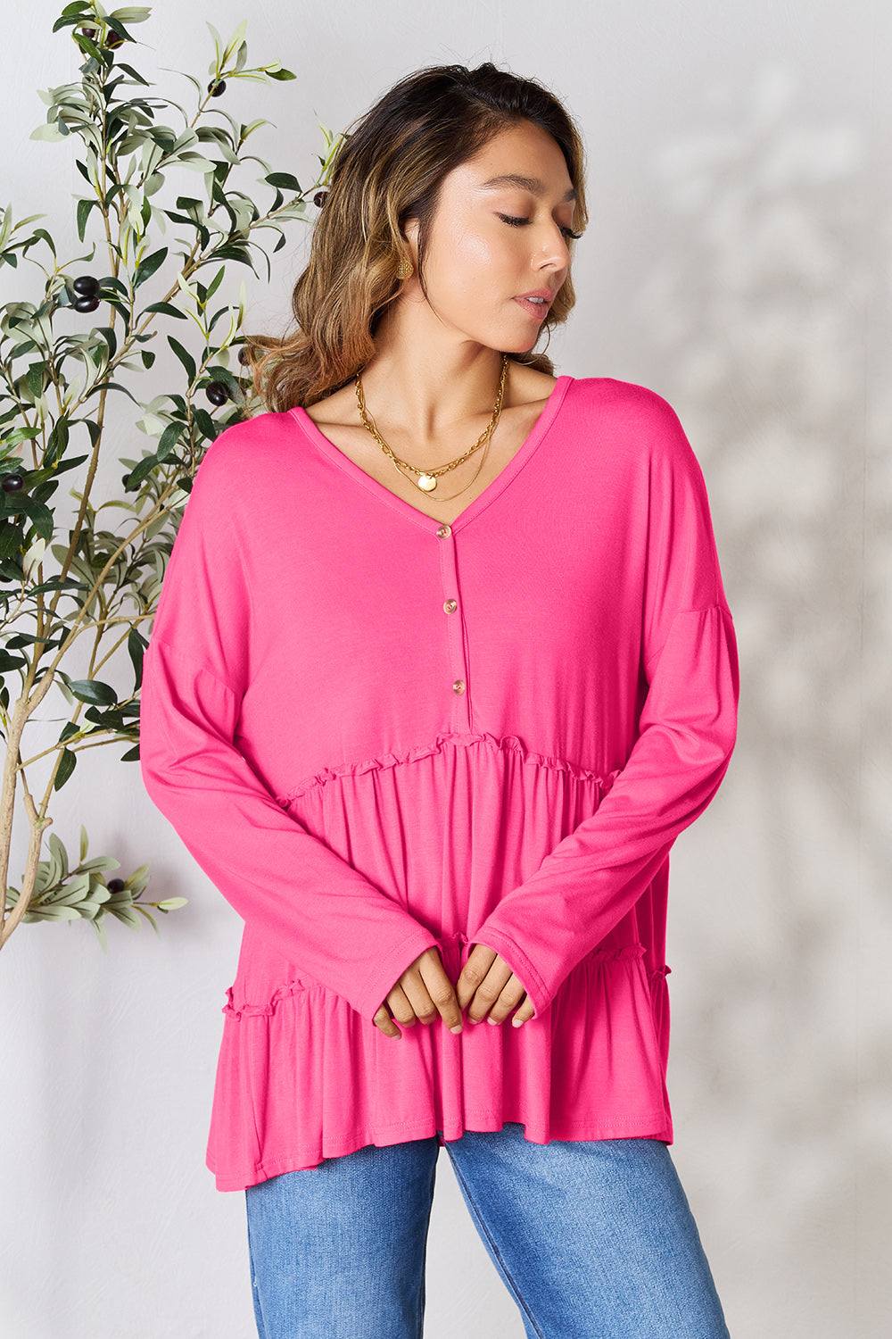 Double Take pink half button long sleeve ruffle hem blouse.