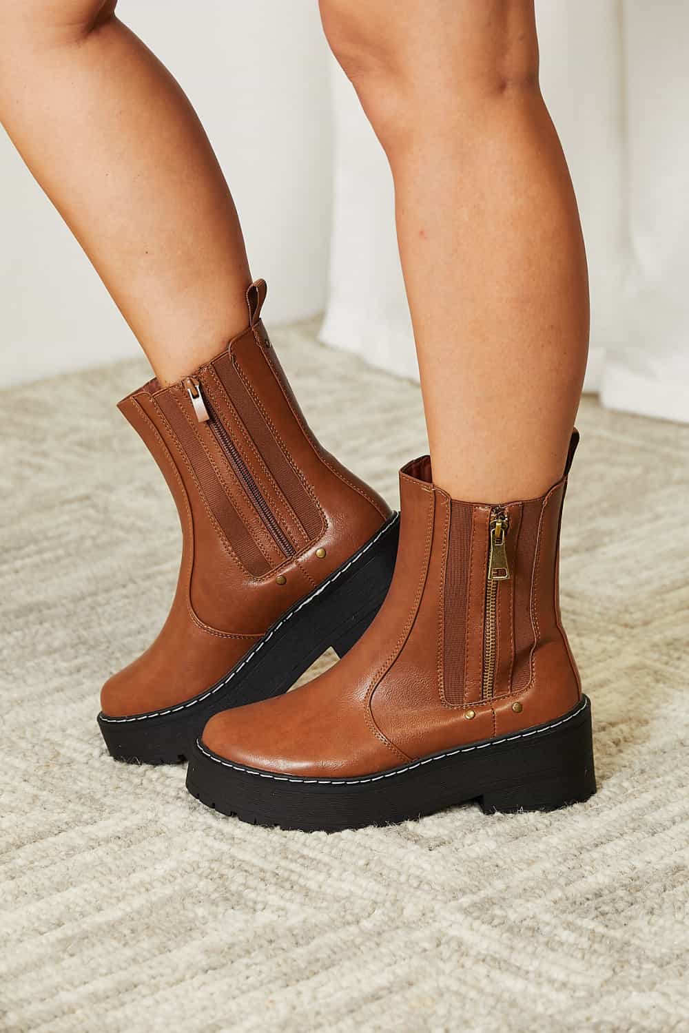 Forever Link Side Zip Platform Boots with low heels and sleek design.