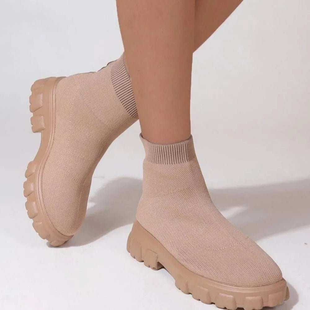 Mesh round toe platform boots with low heels and rubber soles.