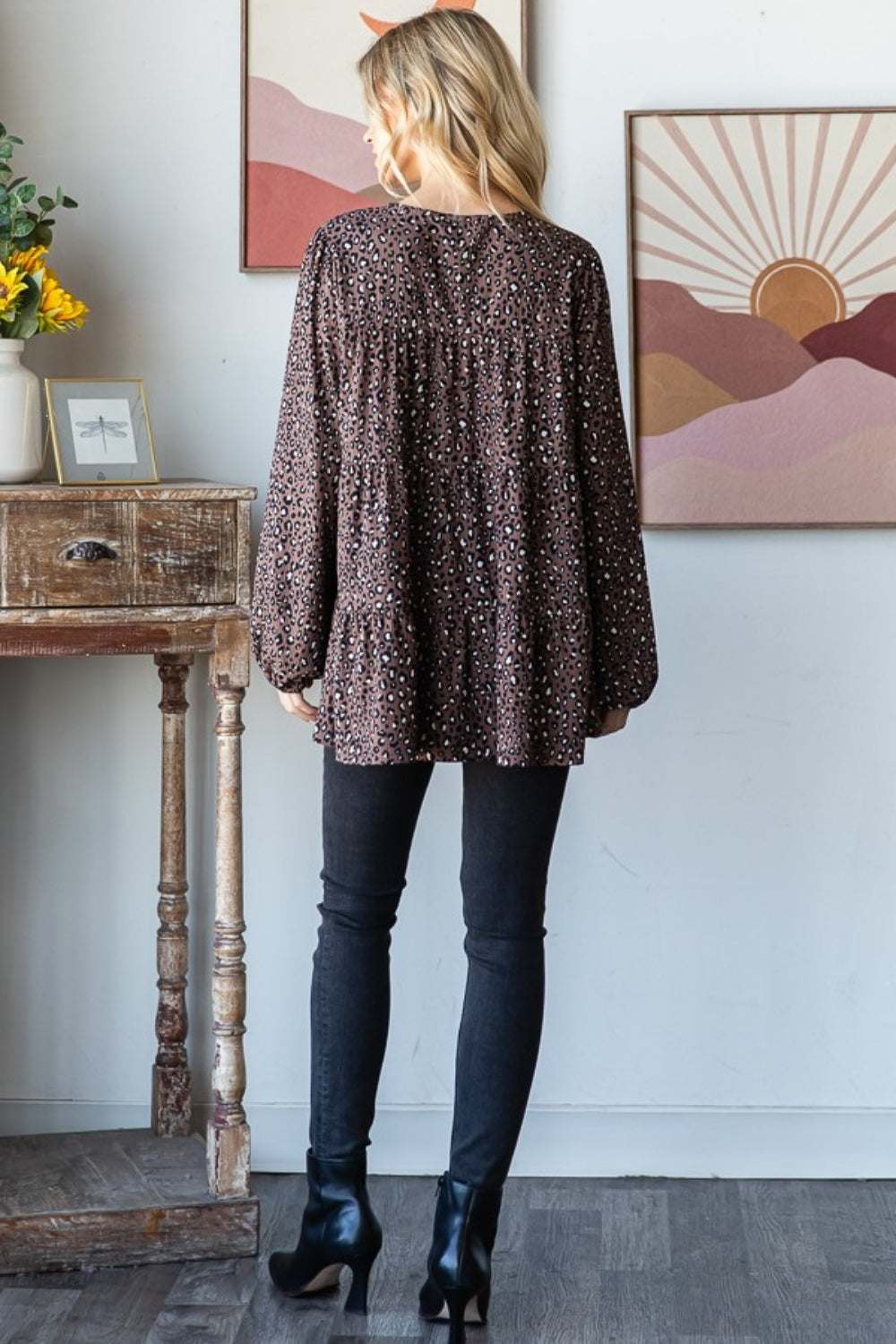 Heimish Leopard Blouse, long sleeve tiered design, worn with black pants.