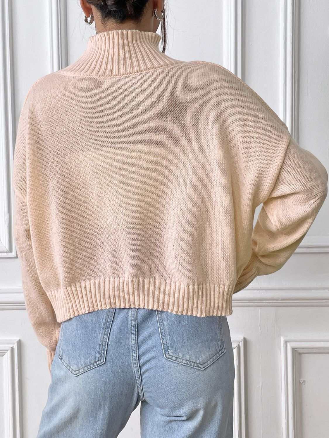 Bow Turtleneck Long Sleeve Sweater in beige, back view, featuring slightly stretchy 100% polyester fabric.