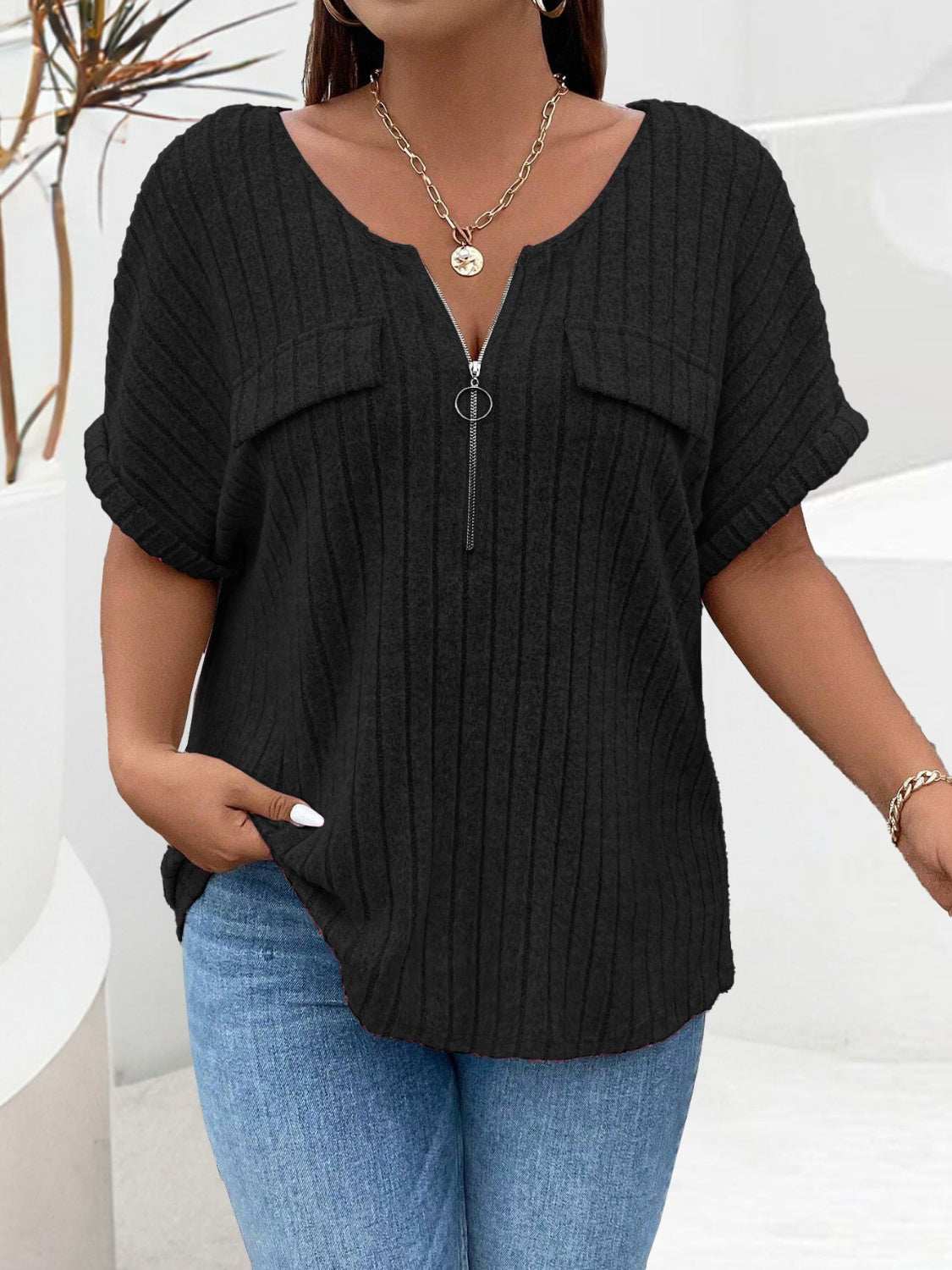 Plus size black half zip short sleeve T-shirt, slightly stretchy polyester.