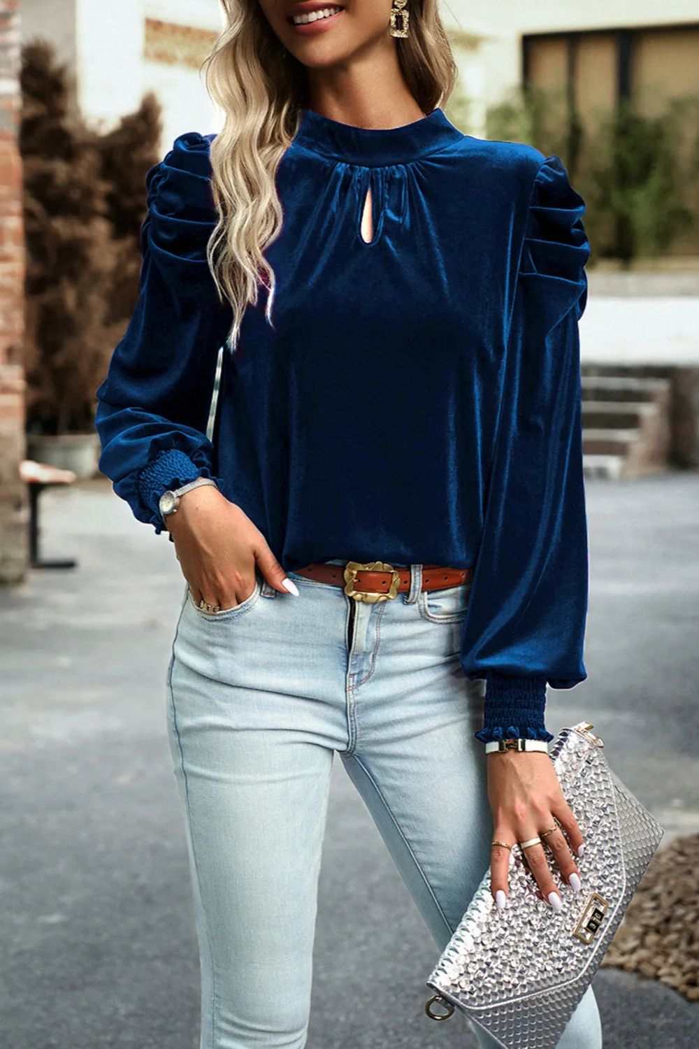 Mock neck velvet fabric long sleeve blouse with tie-up detail, modeled outdoors.