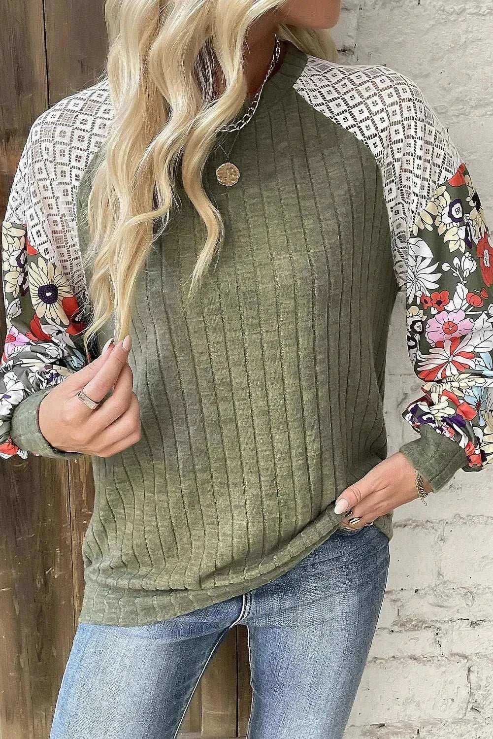 Printed round neck long sleeve top with floral and geometric patterns, slightly stretchy fabric.