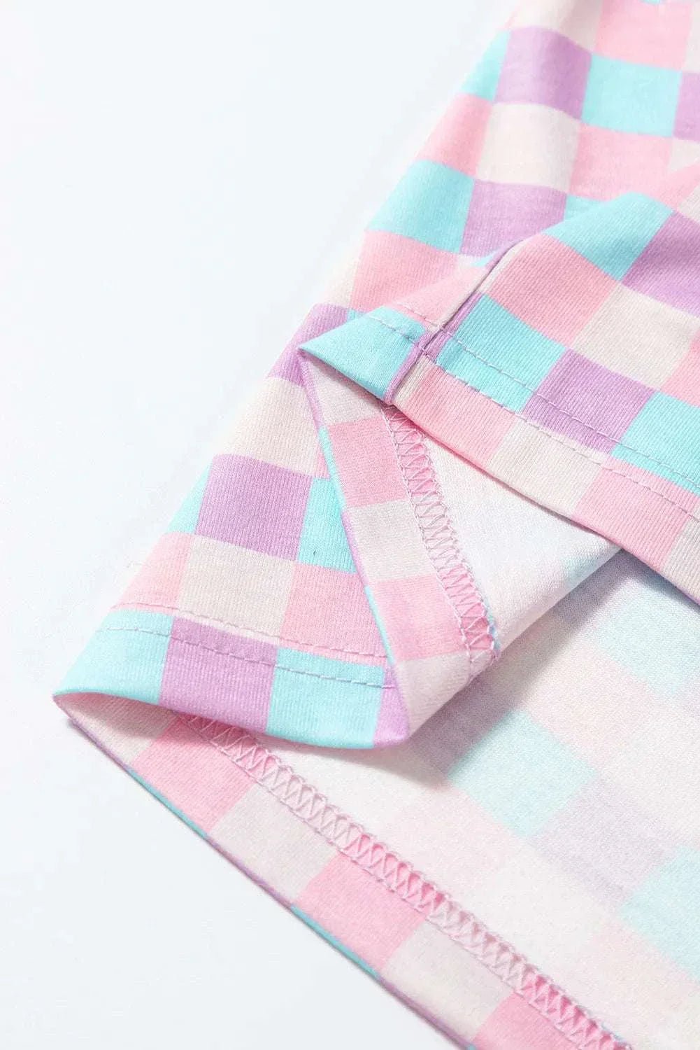 Plaid collared neck short sleeve top and shorts set in pastel colors with pocket detail.