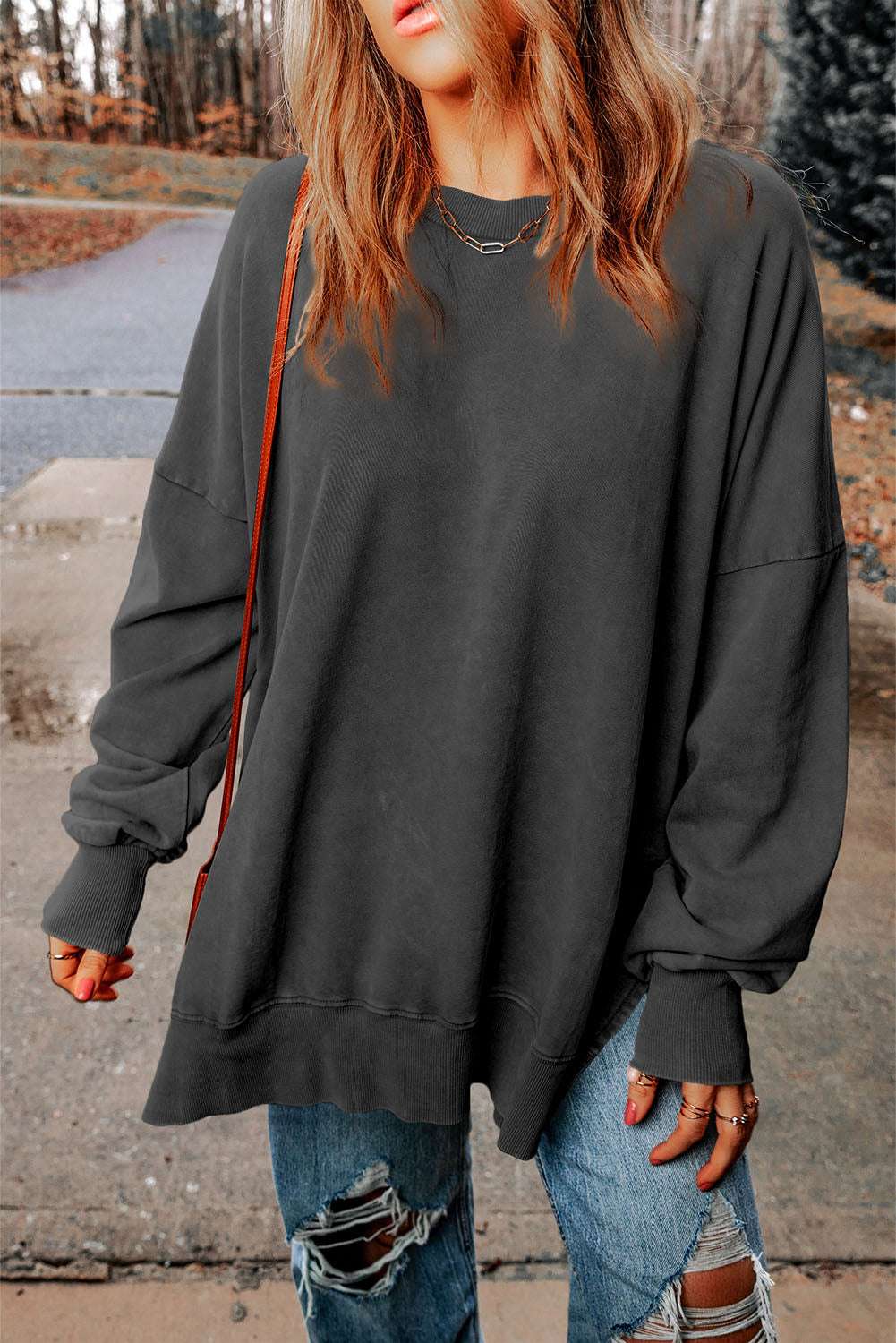 Dropped shoulder round neck long sleeve blouse in solid color with casual style.