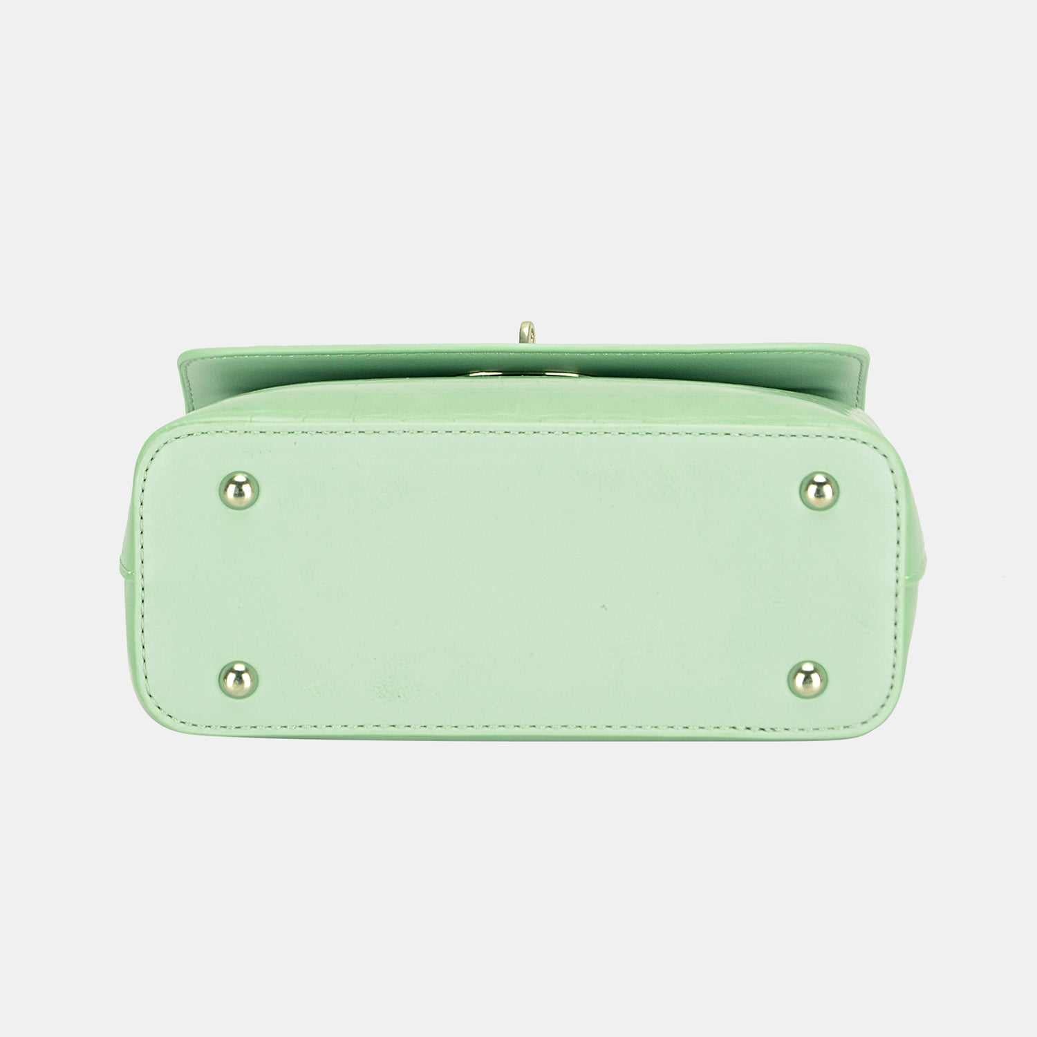 Mint green David Jones PU leather handbag with protective studs on the bottom.