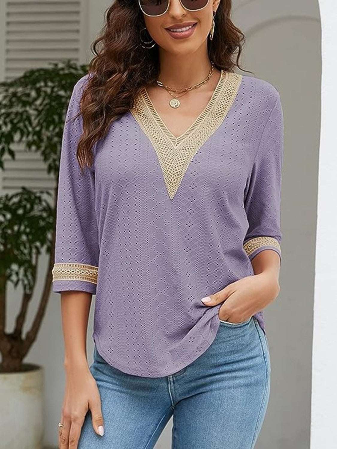 V-Neck Eyelet Blouse in purple with three-quarter sleeves and decorative trim.