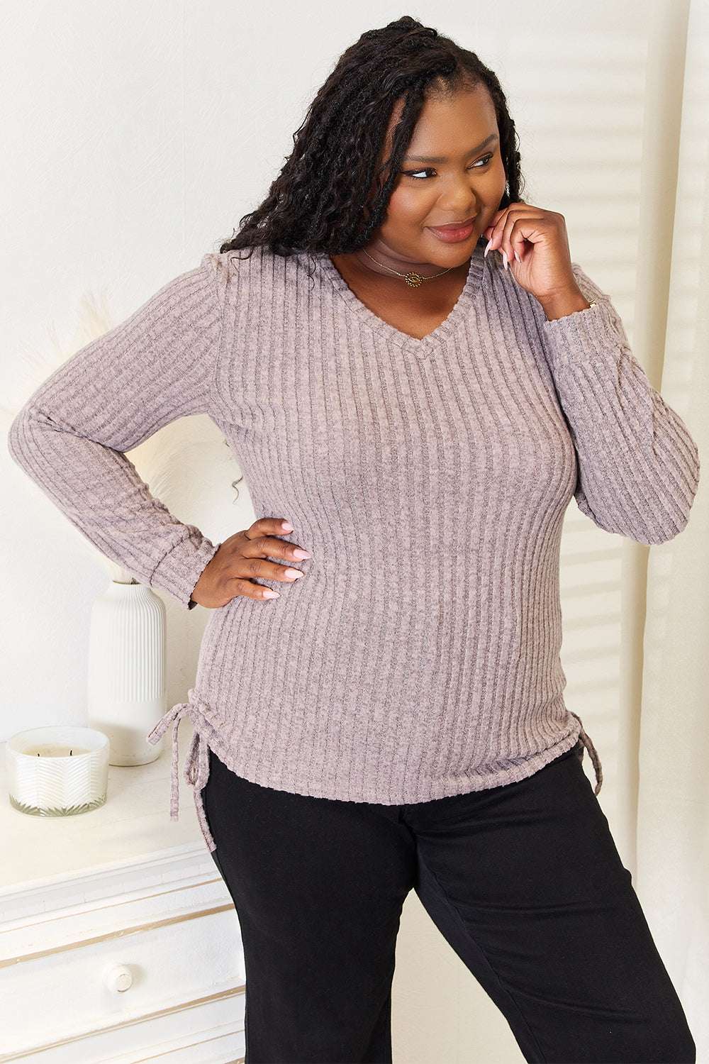 Curve model wearing a drawstring ribbed long sleeve t-shirt, showcasing the ribbed texture and drawstring detail.