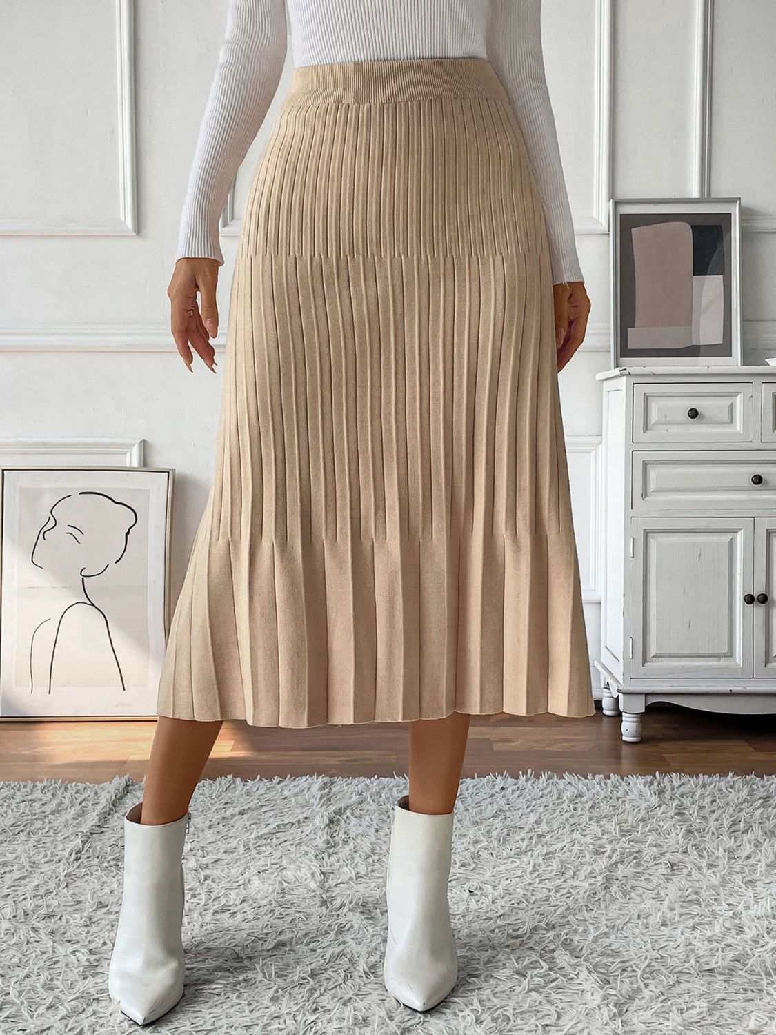 Perfee Pleated Midi Sweater Skirt in beige with stretchy fabric, featuring a basic style design.
