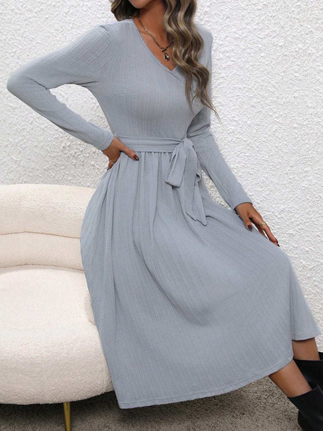 Surplice tie waist long sleeve midi dress in light gray with a tied waist.