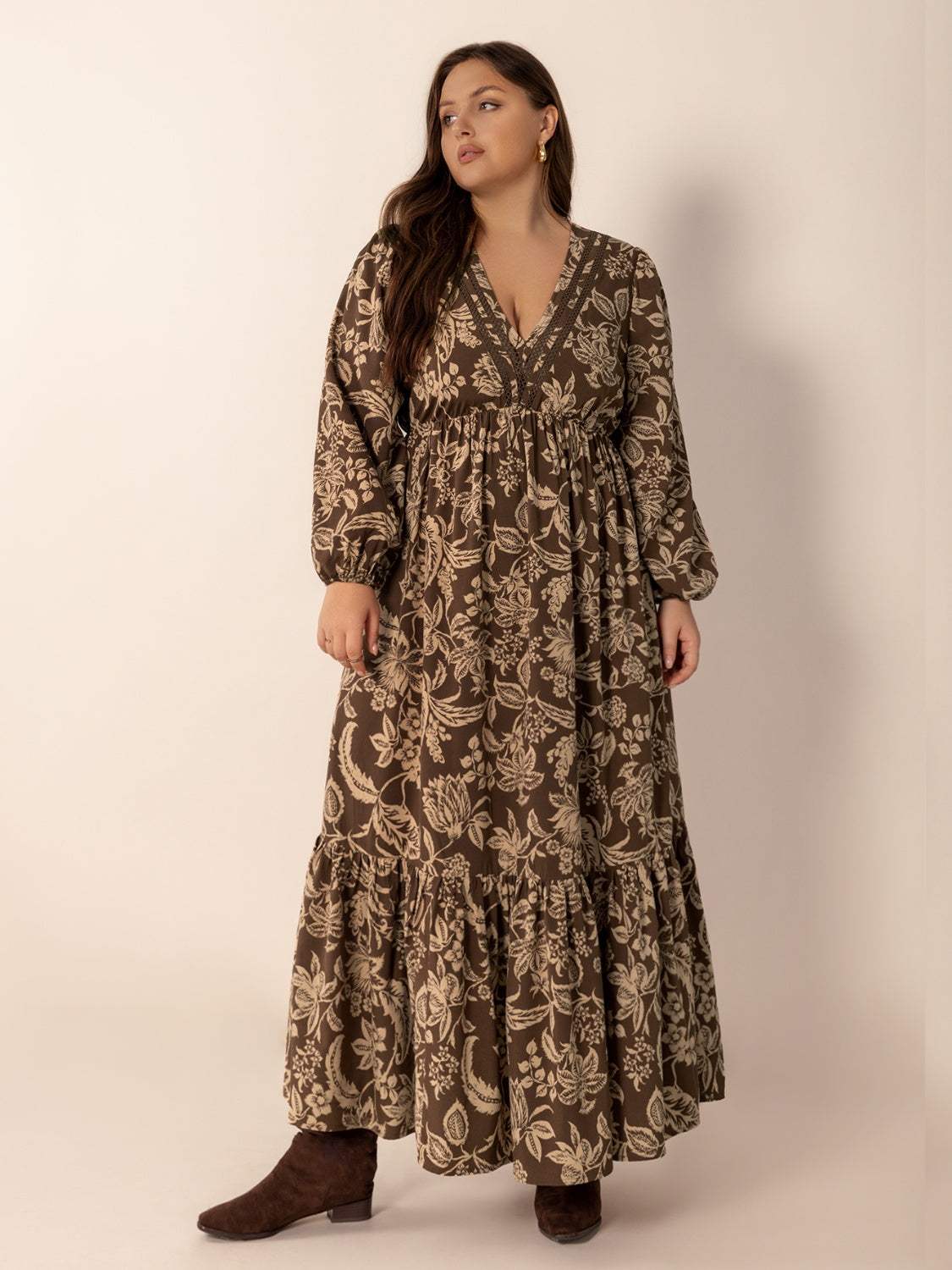Plus size printed V-neck balloon sleeve maxi dress in brown and beige floral pattern.