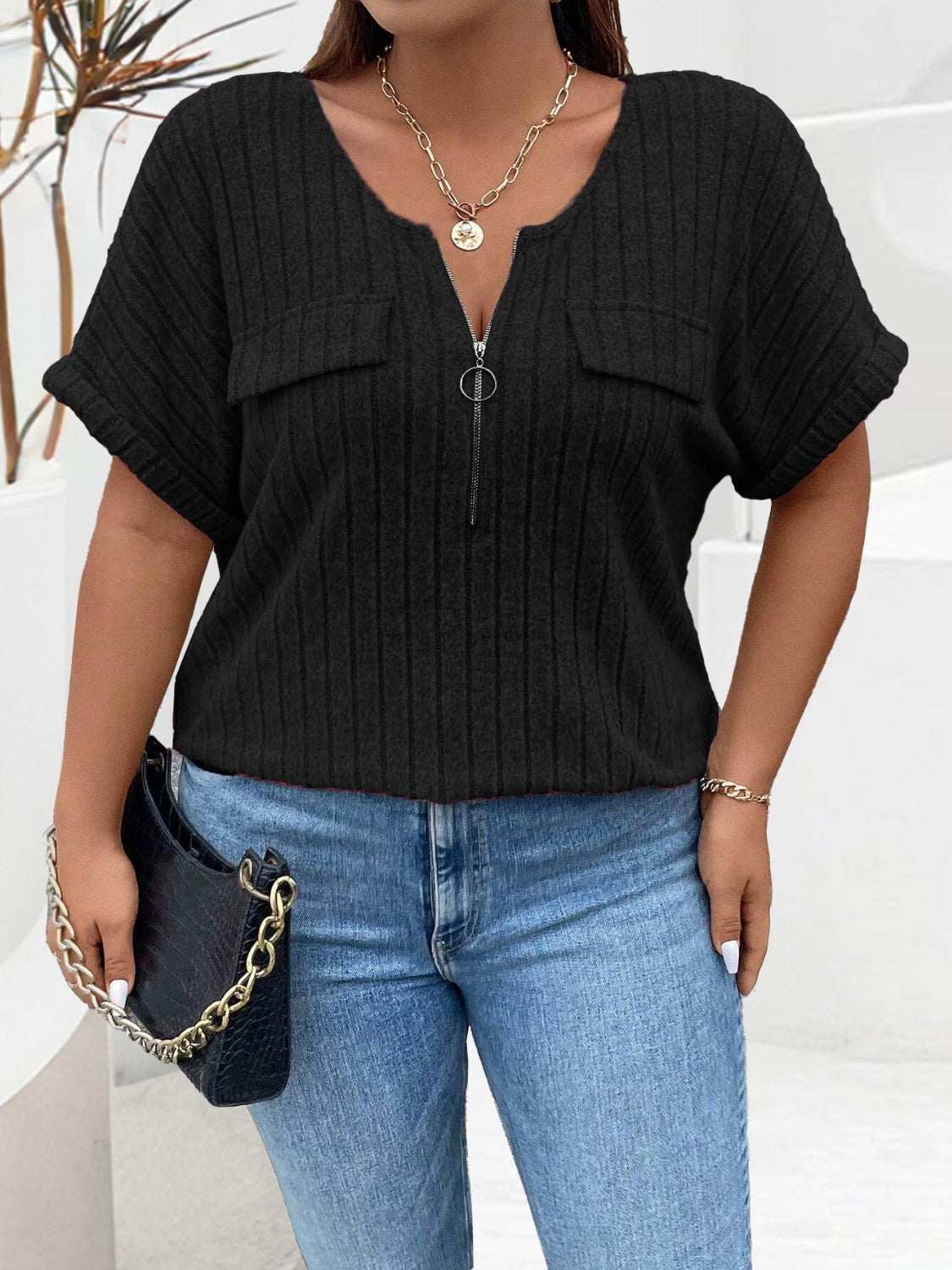 Plus size half zip short sleeve t-shirt in black.