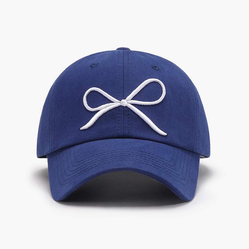 Bow embroidered cotton baseball cap in navy blue.