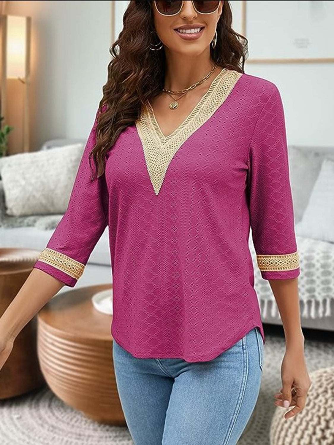 V-Neck Eyelet Blouse in magenta with decorative trim, styled for a casual chic look.