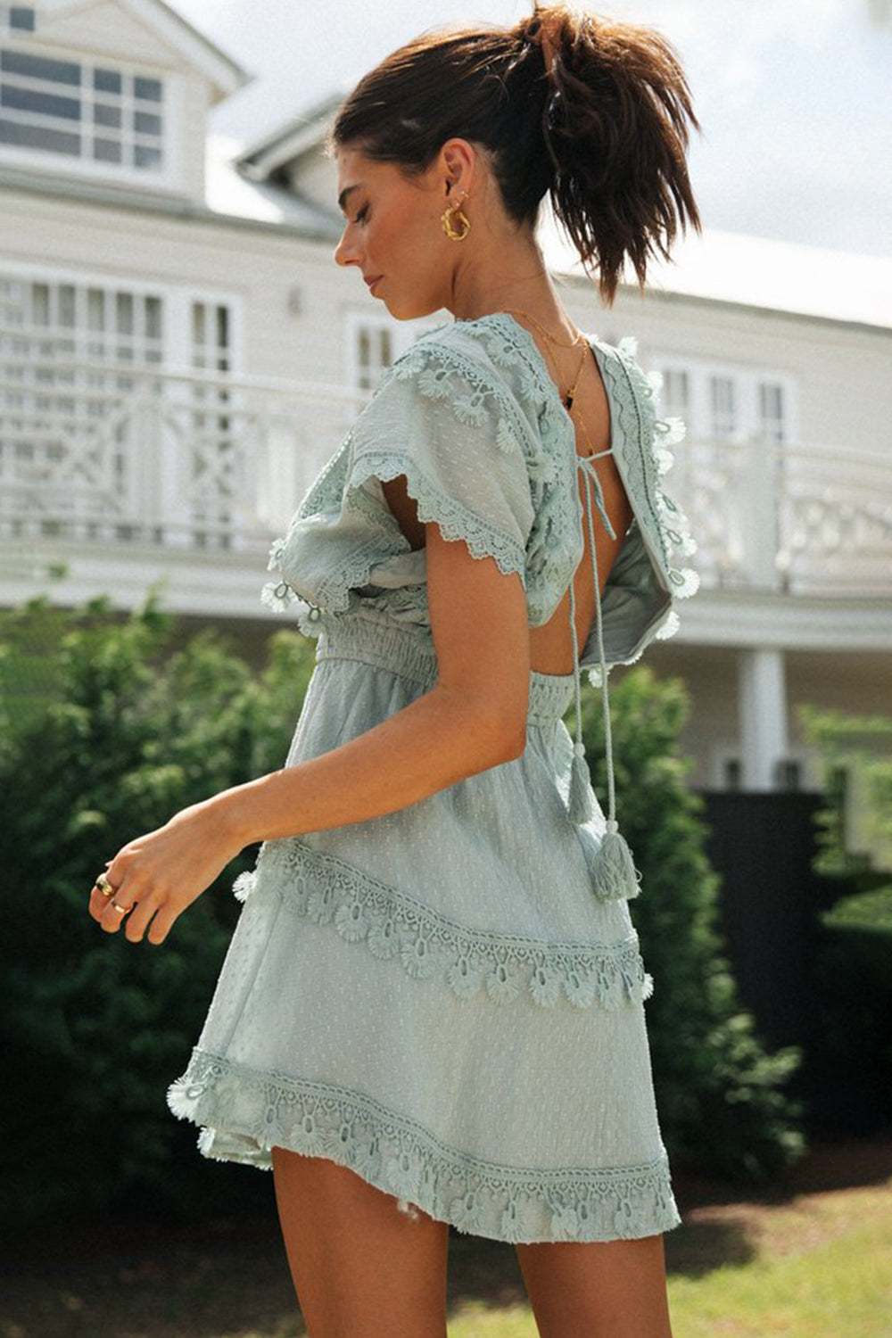 Lace detail plunge short sleeve mini dress in cotton with tied design.
