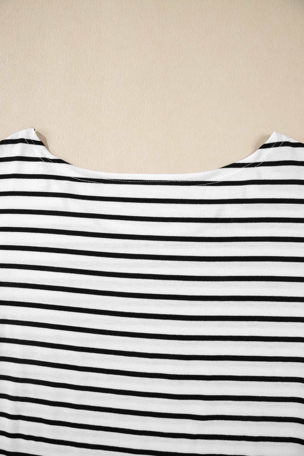 Stripe half sleeve scoop neck top with black and white stripes.