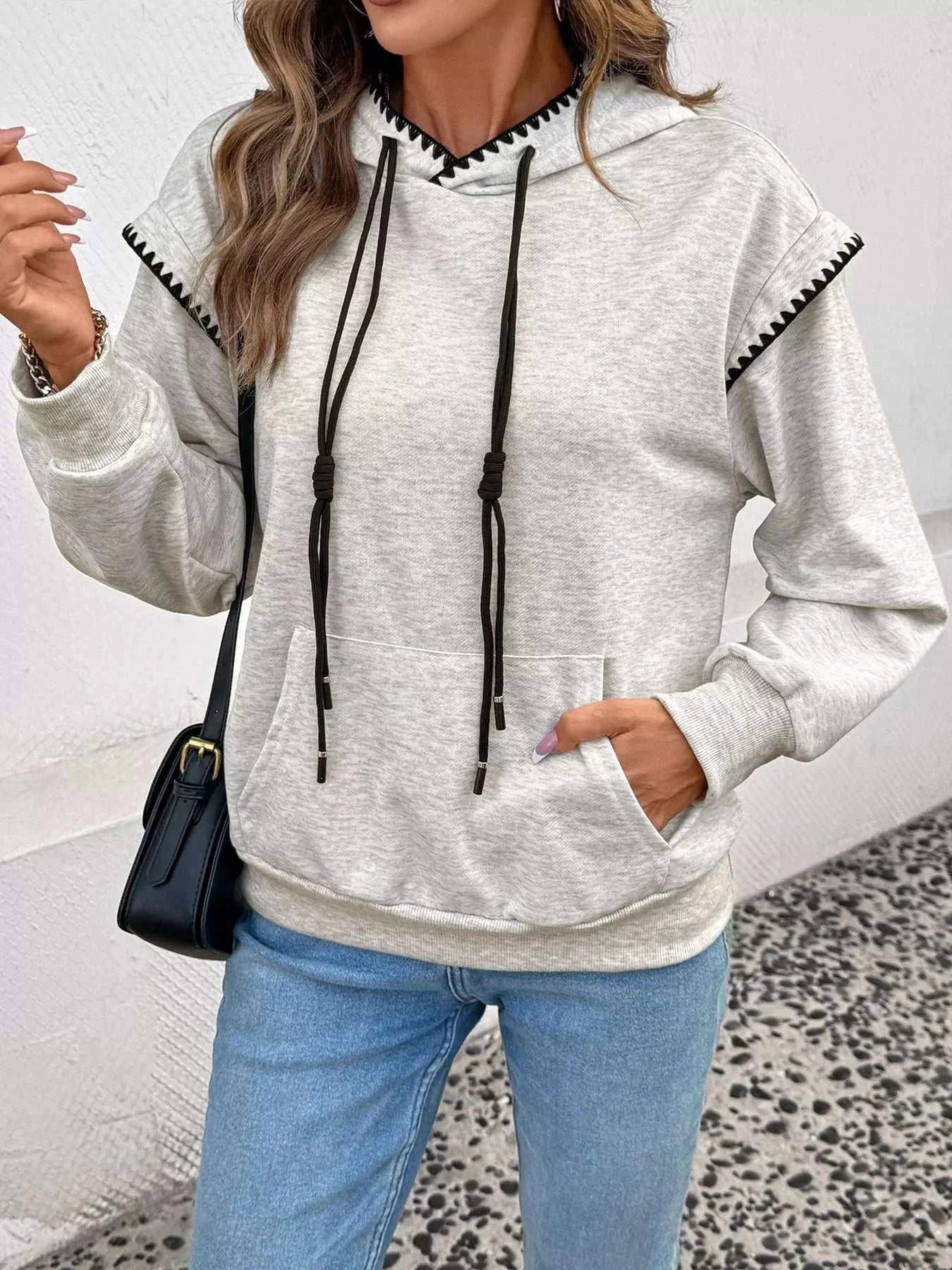 Light gray Contrast Trim Hoodie with black drawstrings and kangaroo pocket, slightly stretchy polyester fabric, casual fit