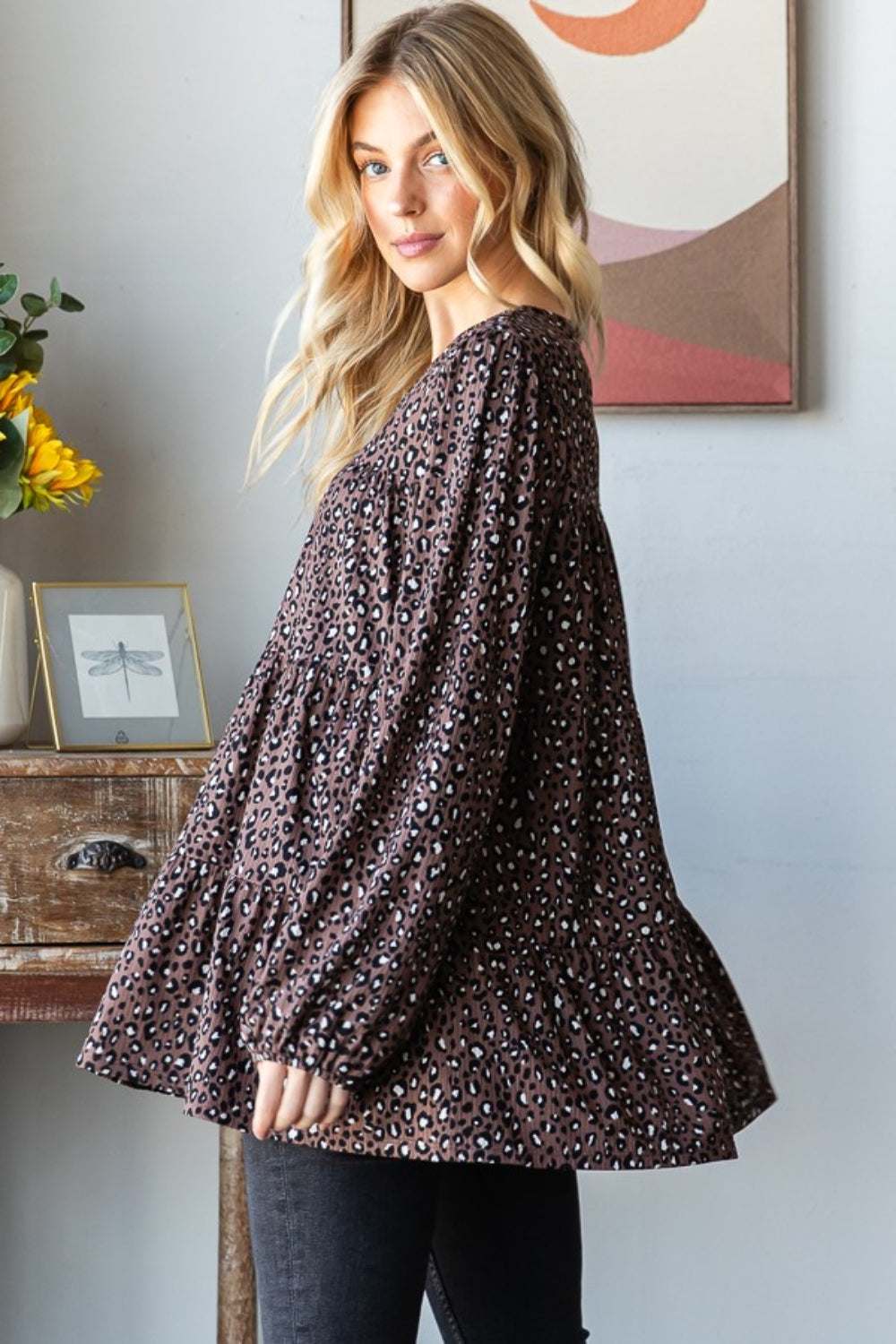 Heimish Leopard Blouse with tiered design and long sleeves.