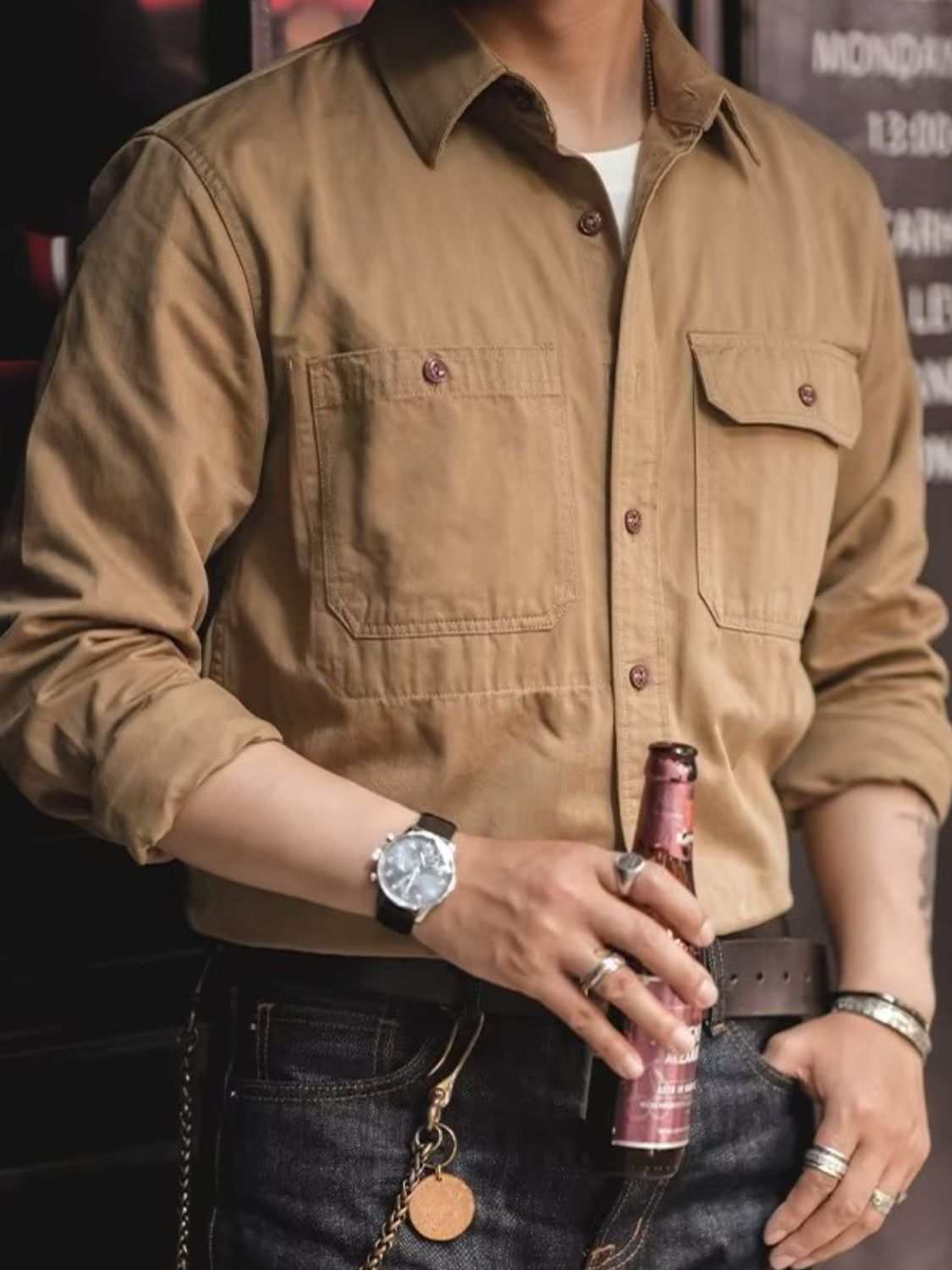 Men's button down long sleeve shirt with chest pockets in casual style.