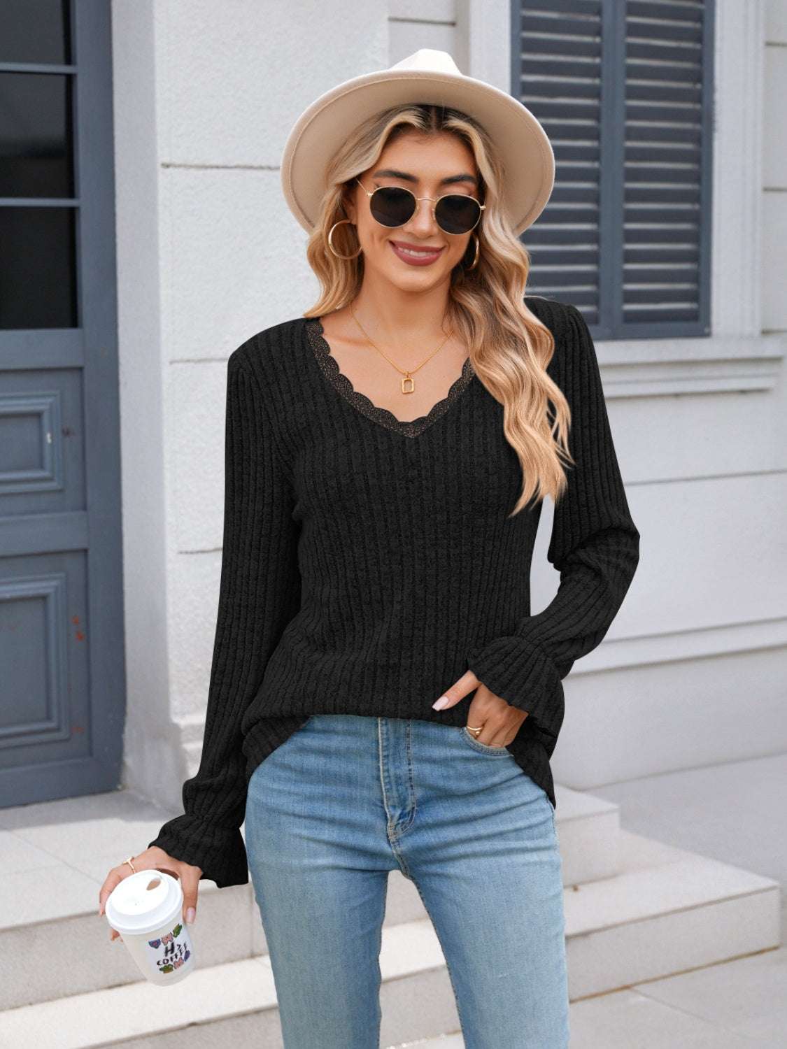 Lace detail V-neck long sleeve T-shirt, black, worn by woman outside.