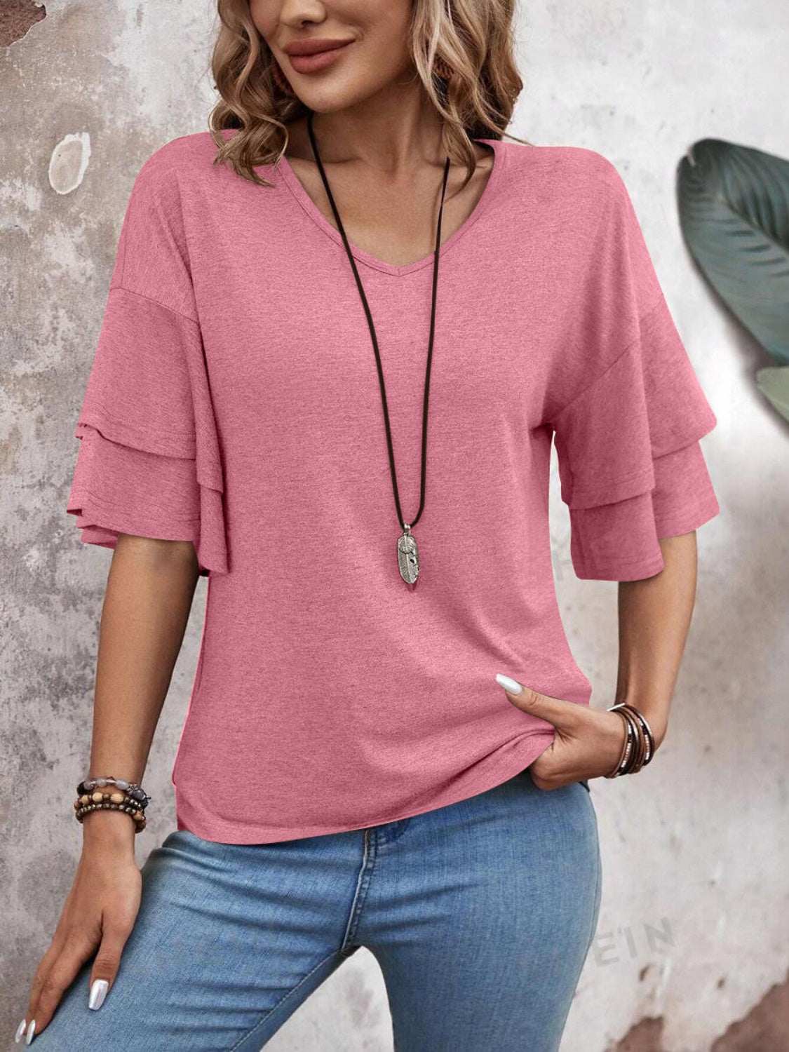 V-Neck Half Sleeve Blouse in pink with layered sleeves, worn by model, paired with blue jeans.