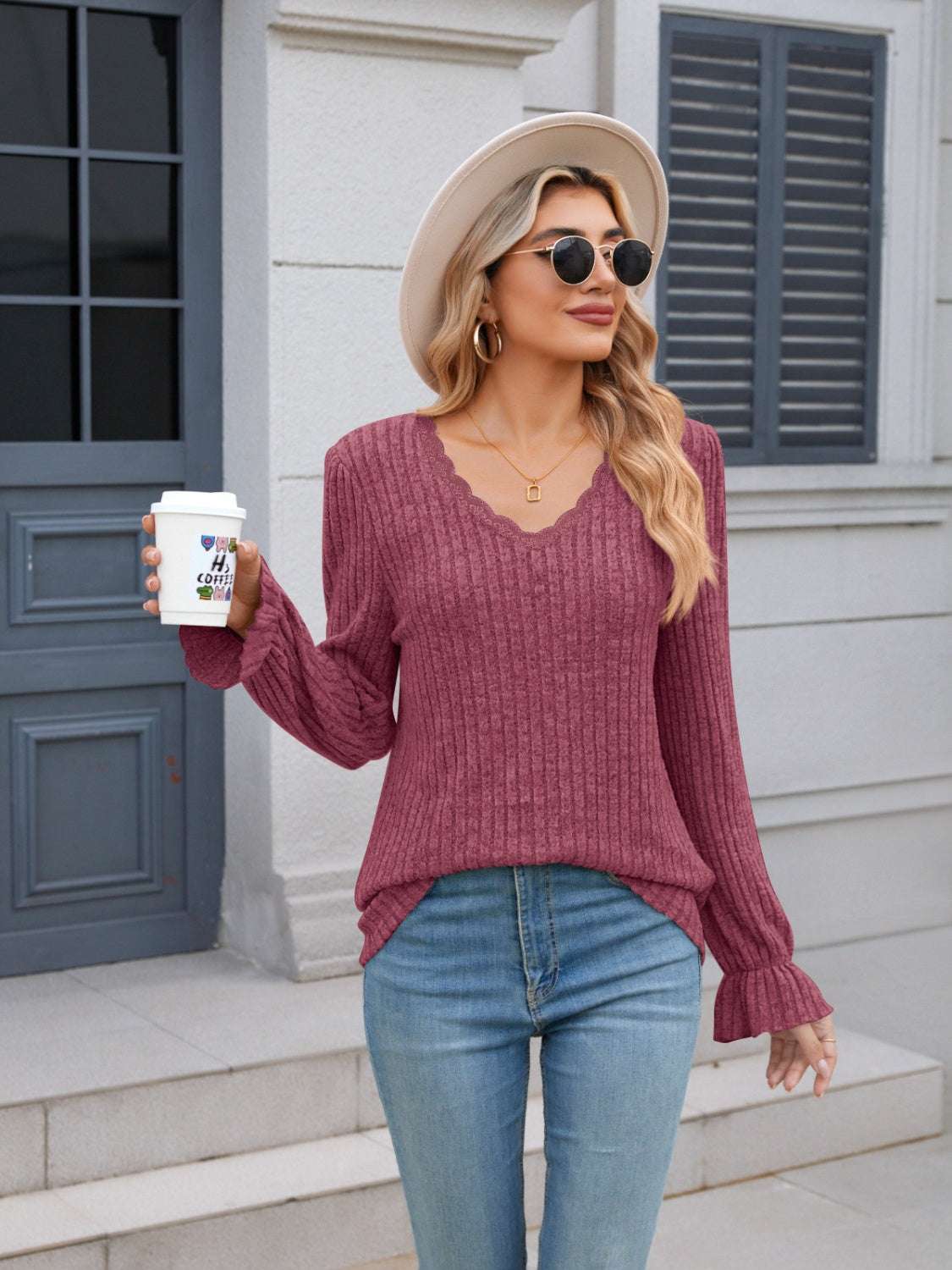 Lace detail V-neck long sleeve T-shirt with ruffled sleeves and slightly stretchy polyester fabric.