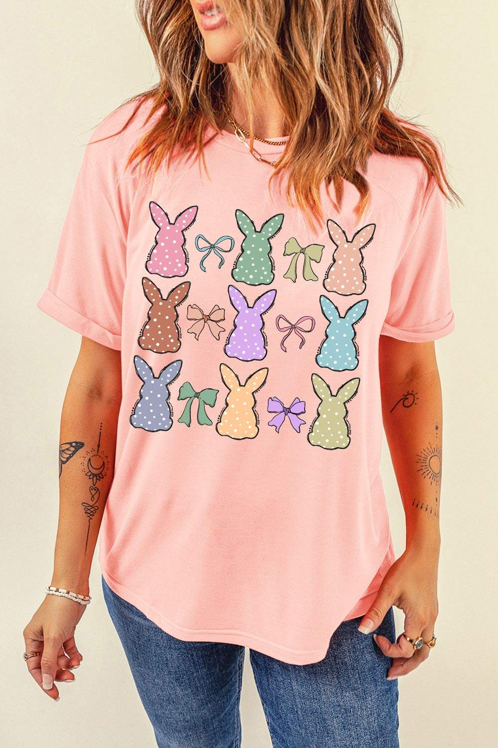 Pink short sleeve t-shirt with dotty bunny bow graphic design.