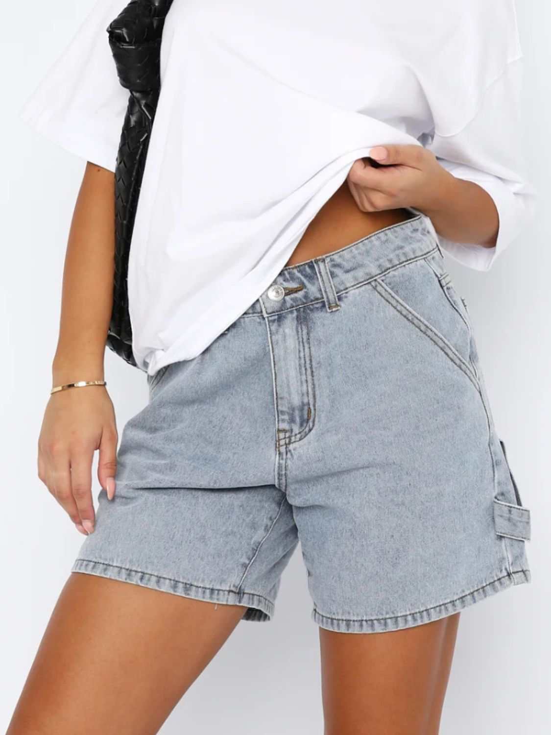 Washed high rise denim shorts with pockets, no stretch, 95% rayon, 5% polyester.