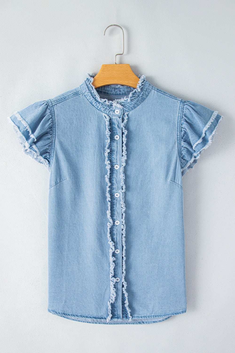 Button down raw hem ruffled denim shirt made of 100% cotton.