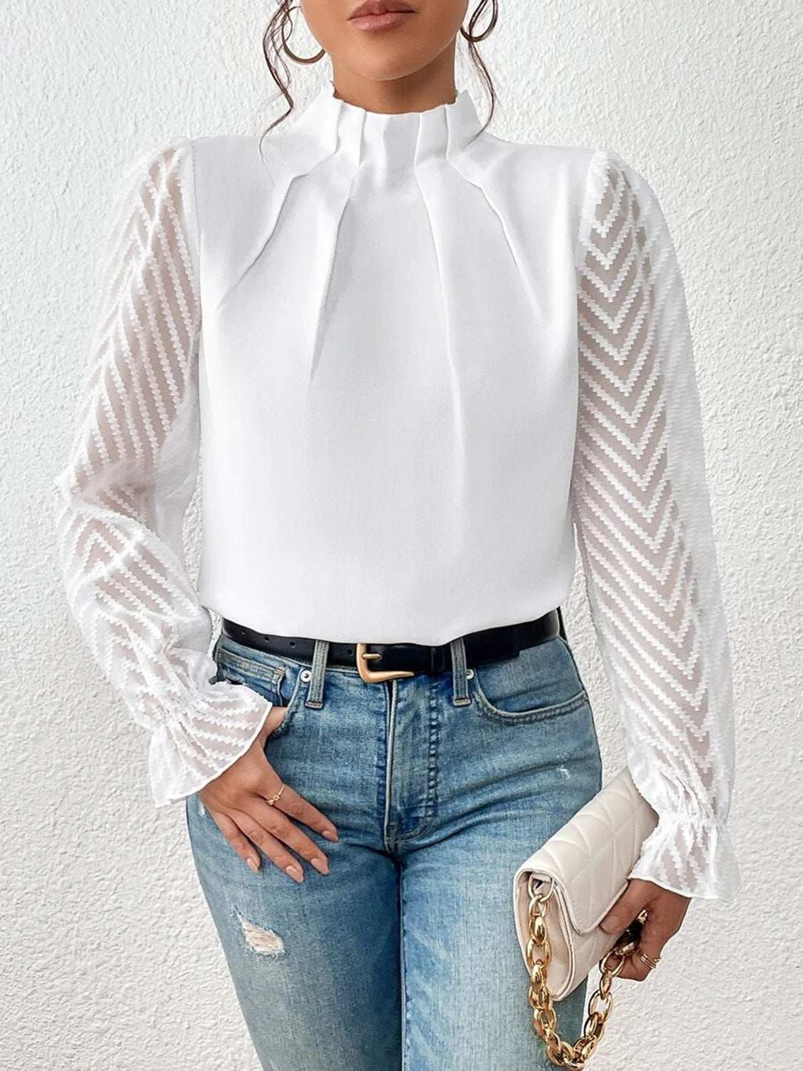 Mock neck flounce sleeve blouse with ruffled details and semi-sheer fabric.