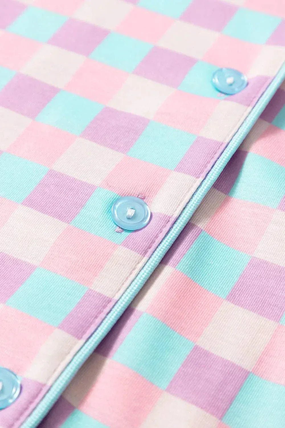 Plaid collared neck short sleeve top and shorts set with buttons.