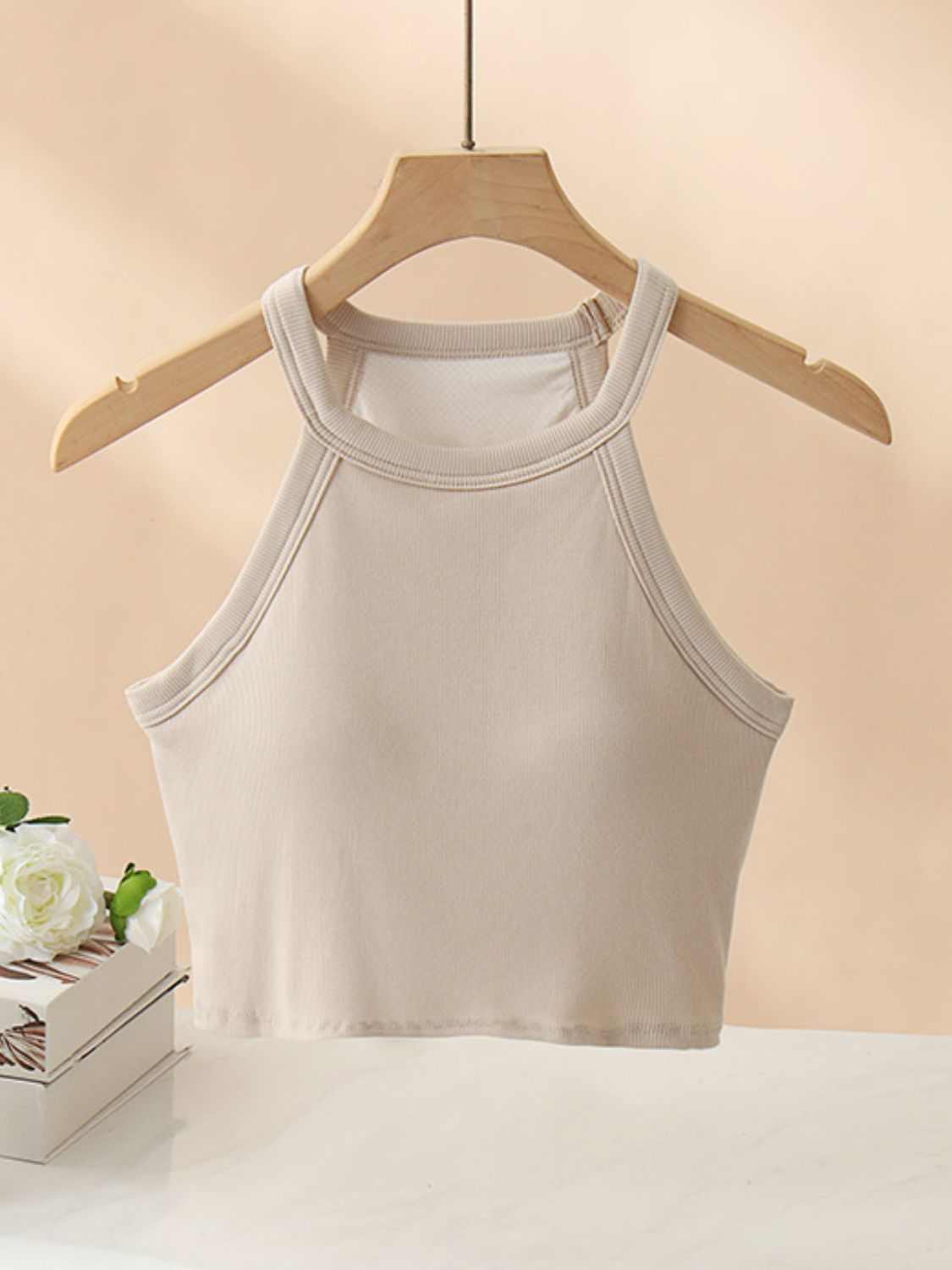 Ribbed Grecian neck cropped tank with chest pads, highly stretchy and opaque.