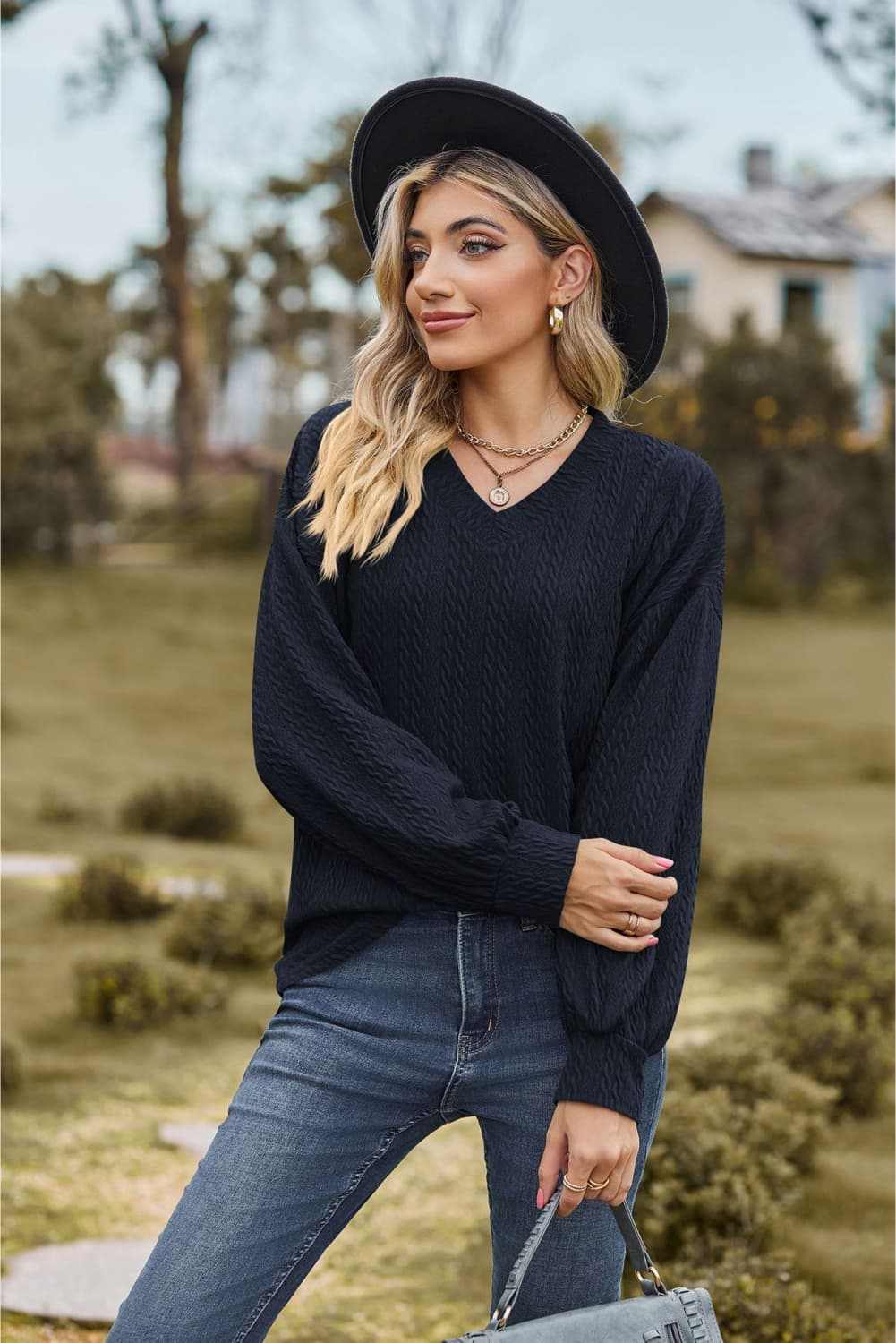V-Neck Dropped Shoulder Blouse with long sleeves, casual solid design.