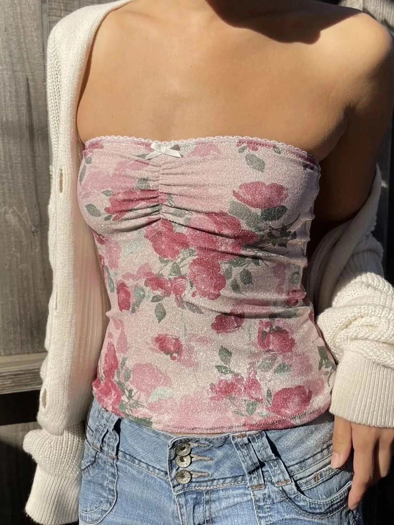 Floral print tube top in pink with ruched front detail.