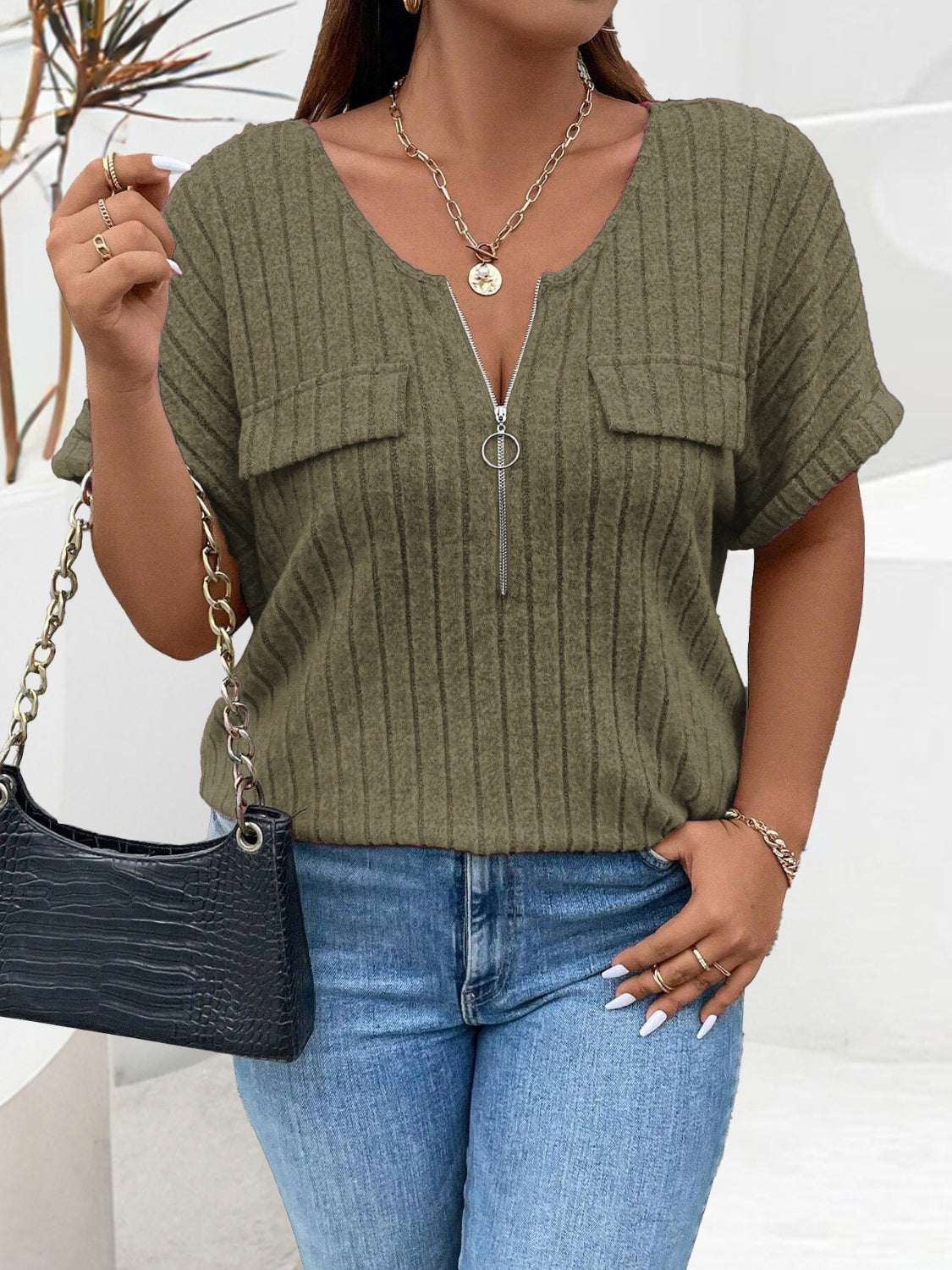 Plus size half zip short sleeve t-shirt in olive green, ribbed texture, V-neck.