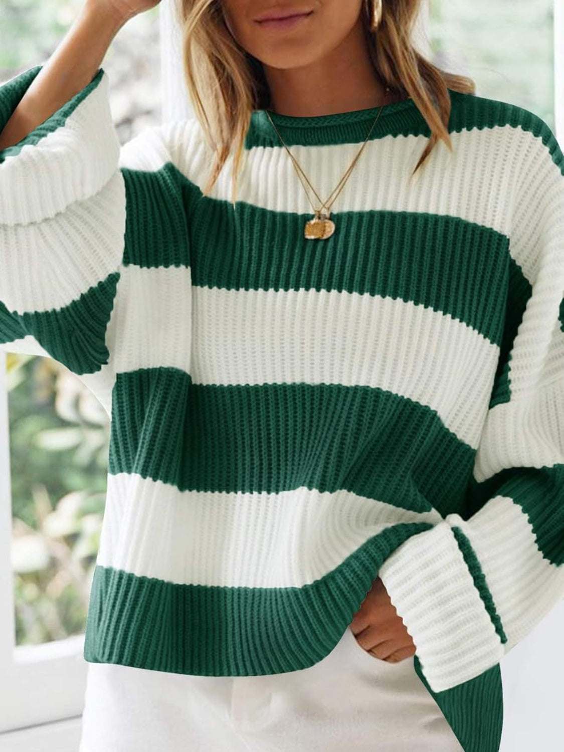 Striped round neck long sleeve sweater in green and white, 100% polyester.