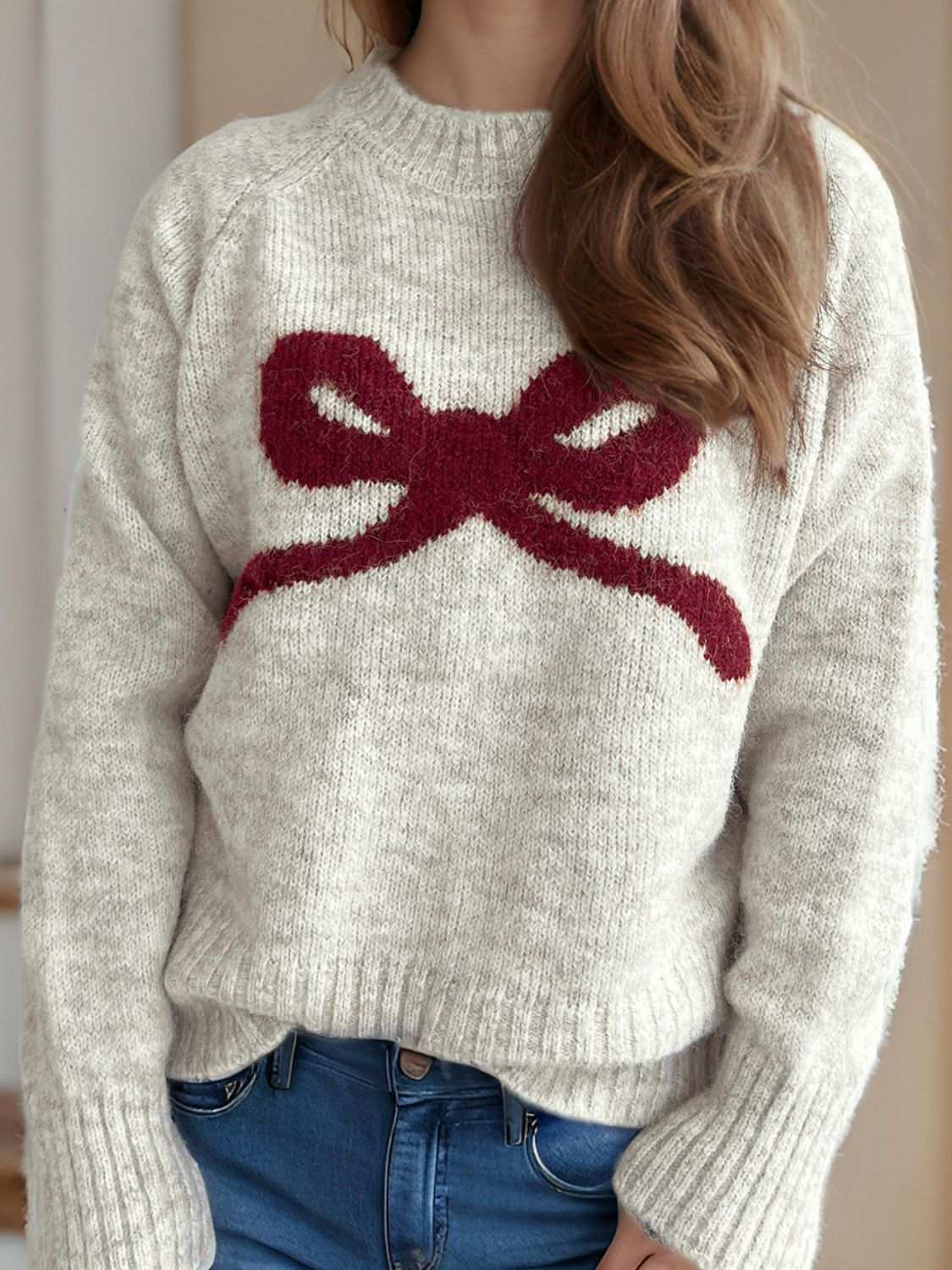 Bow Round Neck Long Sleeve Sweater with red bow detail, slightly stretchy, polyester-acrylic blend.