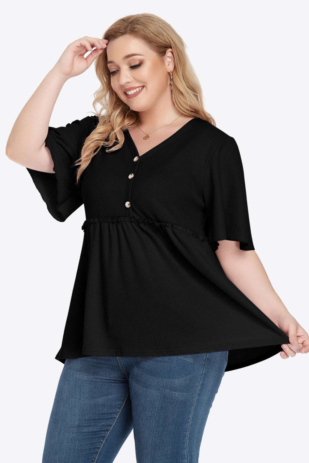 Plus size black V-neck frill trim babydoll blouse with buttons and flutter sleeves.