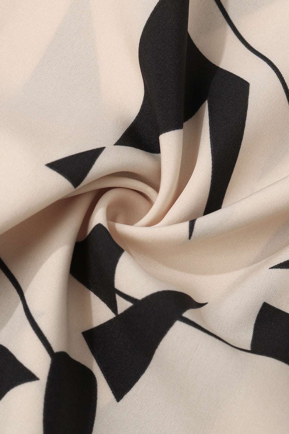 Perfee Printed Johnny Collar Blouse fabric with black geometric design, 100% polyester.